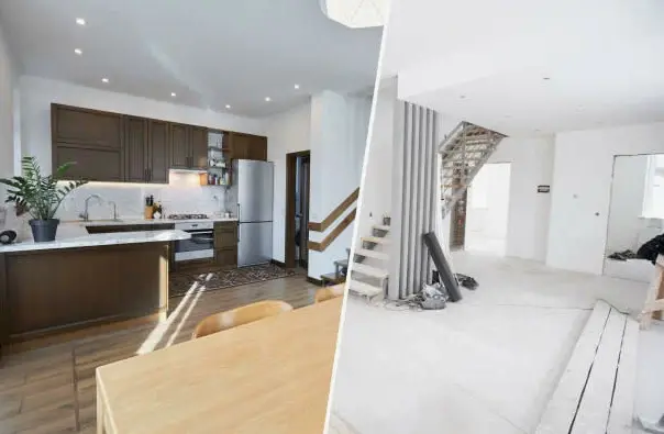 Open-plan remodeled interior with kitchen, staircase, white walls, and light wood flooring.